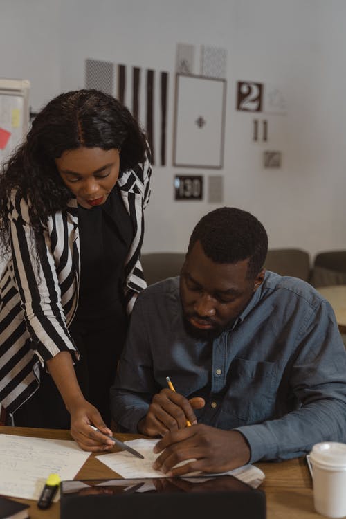 Two people collaborating on a document.